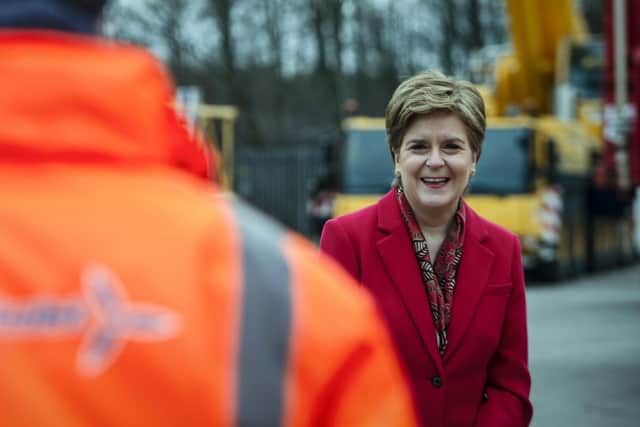 First Minister Nicola Sturgeon during a visit to Irvine. Ms Sturgeon has announced extra Covid restrictions will be lifted from Monday. Picture: Andy Buchanan - WPA Pool/Getty Images