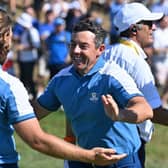 Tommy Fleetwood and Rory McIlroy celebrate winning their match in the opening session in the Ryder Cup in Rome. Picture: Alberto Pizzoli/AFP via Getty Images.