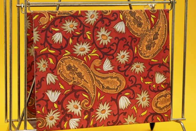 The Paisley teardrop design has worked its way into garments and objects around the world, including this magazine rack. PIC: Contributed.
