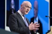 First Minister John Swinney delivers his address at the SNP annual national conference at the Edinburgh International Conference Centre on Sunday (Picture: Jane Barlow/PA Wire)