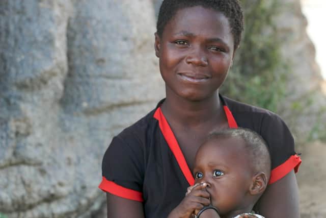 Mwanasha, a farmer living in a remote area in southern Malawi, and daughter.  Malaria is a major contributor to entrenched poverty, with women and girls the most affected. PIC: Lindsay Mgbor/Department for International Development