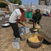 Workers of 'Saylani welfare trust' cook food for flood-affected people in Hyderabad in Sindh province. Monsoon rains have submerged a third of Pakistan, claiming at least 1,190 lives since June and unleashing powerful floods that have washed away swathes of vital crops and damaged or destroyed more than a million homes.