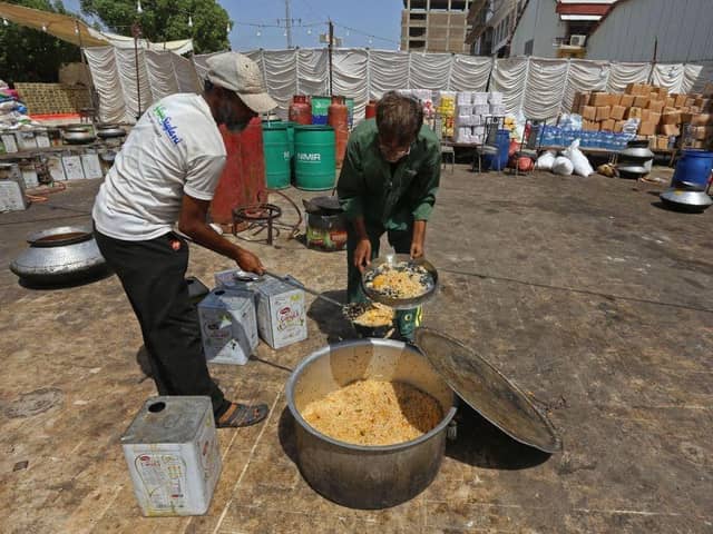 Workers of 'Saylani welfare trust' cook food for flood-affected people in Hyderabad in Sindh province. Monsoon rains have submerged a third of Pakistan, claiming at least 1,190 lives since June and unleashing powerful floods that have washed away swathes of vital crops and damaged or destroyed more than a million homes.