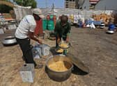 Workers of 'Saylani welfare trust' cook food for flood-affected people in Hyderabad in Sindh province. Monsoon rains have submerged a third of Pakistan, claiming at least 1,190 lives since June and unleashing powerful floods that have washed away swathes of vital crops and damaged or destroyed more than a million homes.