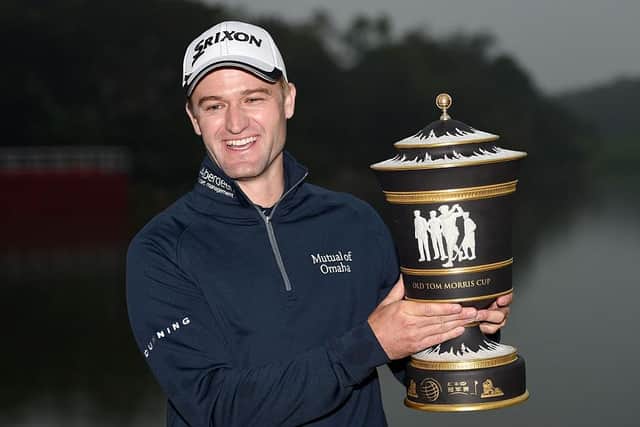 The smile on his face says it all as Russell Knox shows off the trophy after winning the 2015 WGC - HSBC Champions at the Sheshan International Golf Club in China. Picture: Ross Kinnaird/Getty Images.