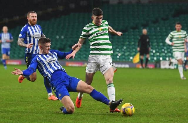 Celtic's Ryan Christie and Stuart Findlay in action during a Scottish Premiership match between Celtic and Kilmarnock at Celtic Park, on December 13, 2020, in Glasgow, Scotland. (Photo by Craig Foy / SNS Group)