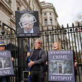 Demonstrators outside the entrance to 10 Downing Street yesterday (Photo by Tolga Akmen/AFP via Getty Images)