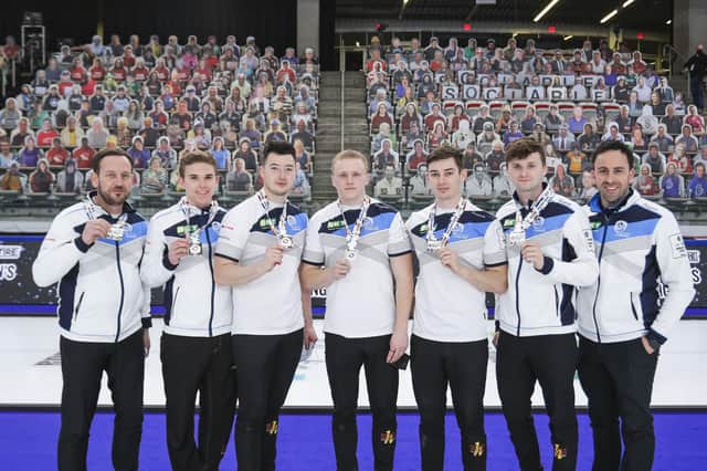 Scotland show off their silver medals after the final of the BKT Tires & OK Tire World Men's Curling Championship in Calgary. Picture: WCF/Jeffrey Au