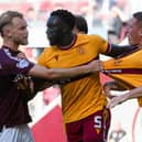 Motherwell's Bevis Mugabi (centre) tries to seperate a scuffle between teammate Dan Casey (right) and Hearts' Nathaniel Atkinson. (Photo by Sammy Turner / SNS Group)