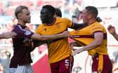Motherwell's Bevis Mugabi (centre) tries to seperate a scuffle between teammate Dan Casey (right) and Hearts' Nathaniel Atkinson. (Photo by Sammy Turner / SNS Group)
