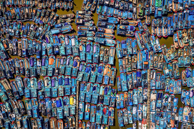 1st colour by Nguyen Vu Cao. Fishermen's boats neatly lined up when installed to avoid typhoon No. 9 in Quang Ngai Vietnam.