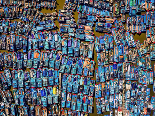 1st colour by Nguyen Vu Cao. Fishermen's boats neatly lined up when installed to avoid typhoon No. 9 in Quang Ngai Vietnam.
