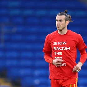 Gareth Bale warms up for the Wales v Czech Republic match in a Show Racism the Red Card t-shirt