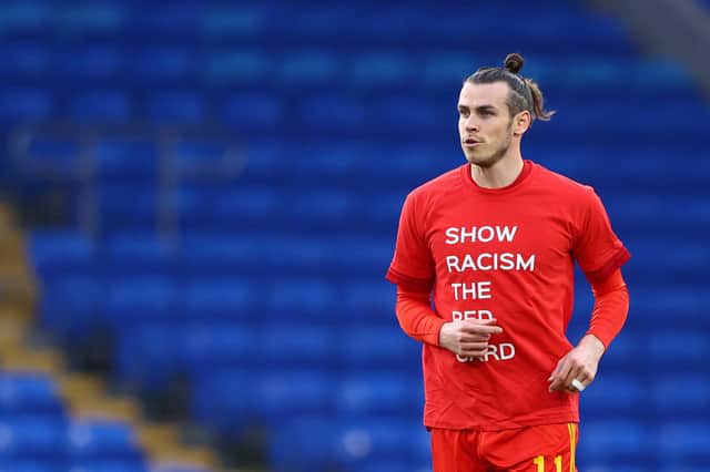 Gareth Bale warms up for the Wales v Czech Republic match in a Show Racism the Red Card t-shirt