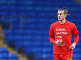 Gareth Bale warms up for the Wales v Czech Republic match in a Show Racism the Red Card t-shirt