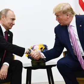 Donald Trump and Vladimir Putin at the G20 summit in Osaka in 2019 (Picture: Brendan Smialowski/AFP)