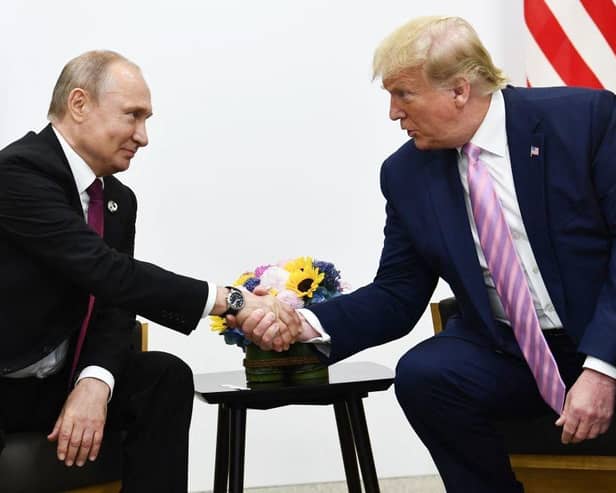 Donald Trump and Vladimir Putin at the G20 summit in Osaka in 2019 (Picture: Brendan Smialowski/AFP)