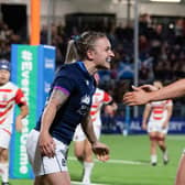 Scotland's Chloe Rollie (L) celebrates scoring a try during the win over Japan at the DAM Health Stadium (Photo by Ross Parker / SNS Group)