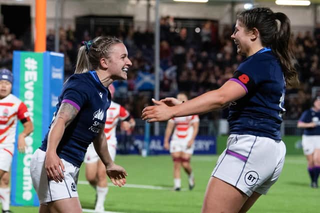 Scotland's Chloe Rollie (L) celebrates scoring a try during the win over Japan at the DAM Health Stadium (Photo by Ross Parker / SNS Group)