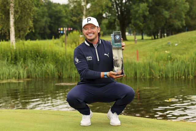 Scotland's Ewen Ferguson poses with the trophy after winning the BMW International Open Golf tournament in Munich/Eichenried, Germany, Sunday, July 7, 2024.  (Christian Kolbert/kolbert-press/dpa via AP)