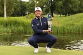 Scotland's Ewen Ferguson poses with the trophy after winning the BMW International Open Golf tournament in Munich/Eichenried, Germany, Sunday, July 7, 2024.  (Christian Kolbert/kolbert-press/dpa via AP)