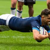 Scotland stand-off Adam Hastings dives over for his try against Fiji.