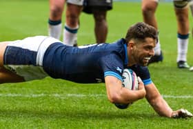 Scotland stand-off Adam Hastings dives over for his try against Fiji.