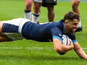 Scotland stand-off Adam Hastings dives over for his try against Fiji.