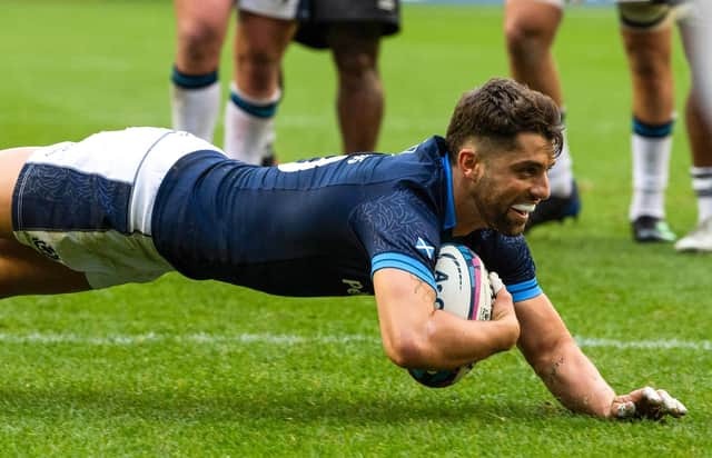 Scotland stand-off Adam Hastings dives over for his try against Fiji.