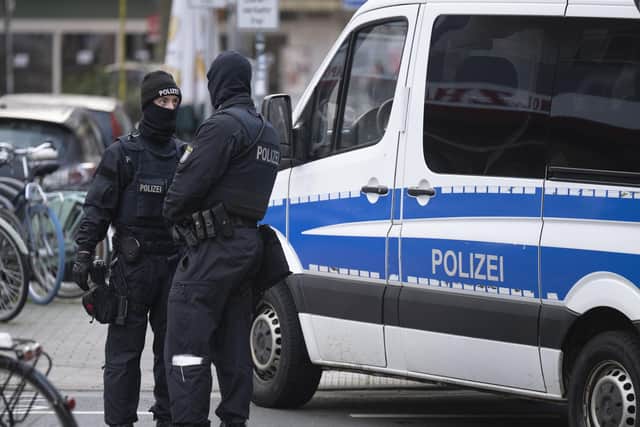 Thousands of police carried out a series of raids across much of Germany on Wednesday against suspected far-right extremists who allegedly sought to overthrow the state by force. (Boris Roessler/dpa via AP)