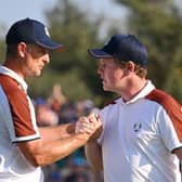 Justin Rose and Robert MacIntyre celebrate during the Saturday afternoon fourball matches in the Ryder Cup at Marco Simone Golf Club in Rome. Picture: Ross Kinnaird/Getty Images.