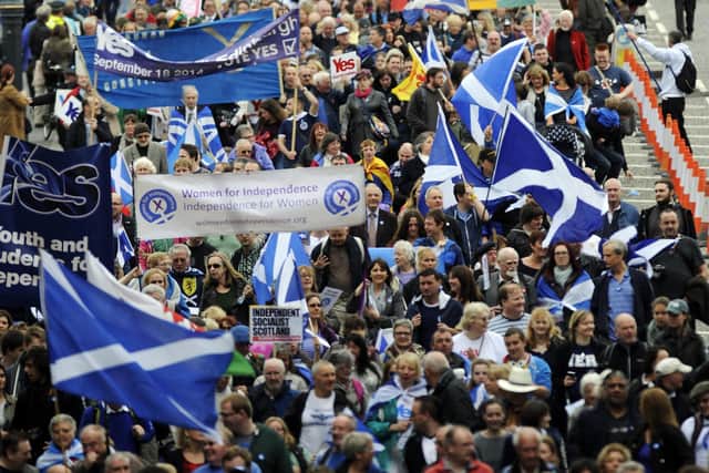 Pro-independence supporters march in Edinburgh on September 21, 2013