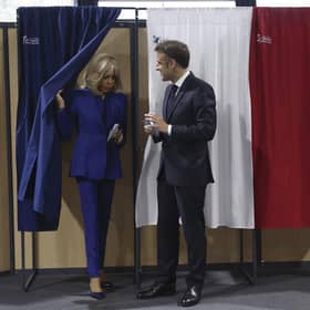 French President Emmanuel Macron and his wife Brigitte Macron leave the voting booth after voting for the second round of the legislative elections in Le Touquet-Paris-Plage, northern France. Picture: Mohammed Badra, Pool via AP