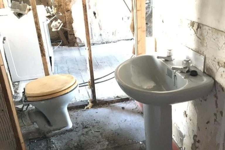 Bathroom - missing a wall.