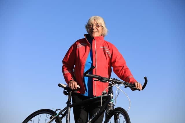 Mavis Paterson, known as Granny Mave, poses with her bike in the countryside of Dumfries and Galloway. Picture: Paul Hackett