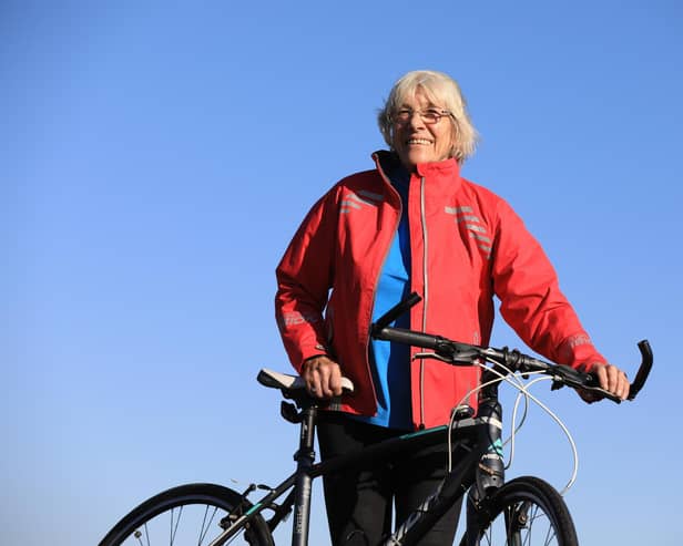 Mavis Paterson, known as Granny Mave, poses with her bike in the countryside of Dumfries and Galloway. Picture: Paul Hackett