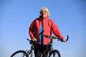 Mavis Paterson, known as Granny Mave, poses with her bike in the countryside of Dumfries and Galloway. Picture: Paul Hackett