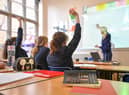 A teacher and students in a classroom. Teacher strikes are due to take place next week. Picture: Ben Birchall/PA Wire