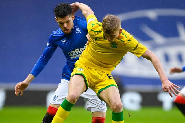 Rangers' Ianis Hagi and Hibernian's Josh Doig during the Scottish Premiership match at Ibrox Stadium on December 26. (Photo by Rob Casey / SNS Group)