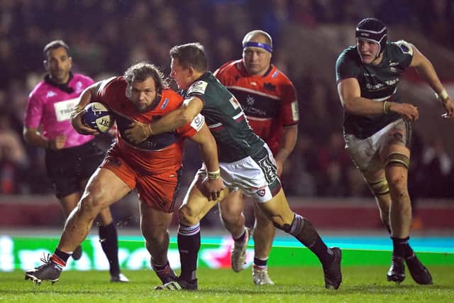 Edinburgh's Pierre Schoeman attempts to get past Leicester Tiger's Jimmy Gopperth (right) on a night where Edinburgh could not find a way past their hosts.