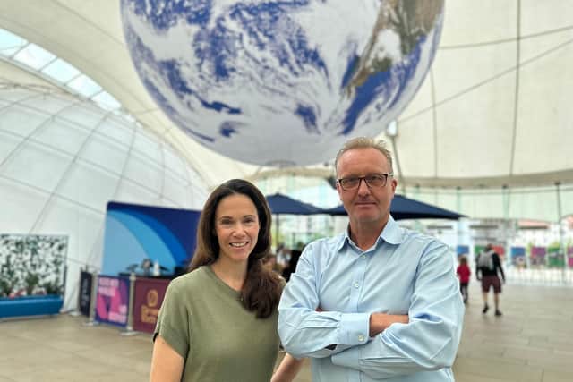 Dynamic Earth's scientific director Dr Hermione Cockburn and chief executive Mark Bishop pose beneath the centre's giant Gaia art installation, which is proving a popular background for selfies by visitors