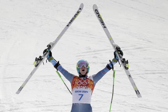 FILE - United States' Ted Ligety celebrates after winning the gold medal in the men's giant slalom at the Sochi 2014 Winter Olympics in Krasnaya Polyana, Russia, in this Wednesday, Feb. 19, 2014, file photo. Two-time Olympic champion Ted Ligety says he will retire from World Cup ski racing after the world championships. Ligetyâ€™s final race will be the giant slalom on Feb. 19 in Cortina dâ€™Ampezzo, Italy. (AP Photo/Charlie Riedel, File)