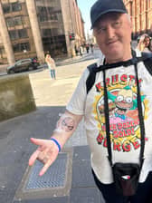 John showcasing his new Spiderman tattoo