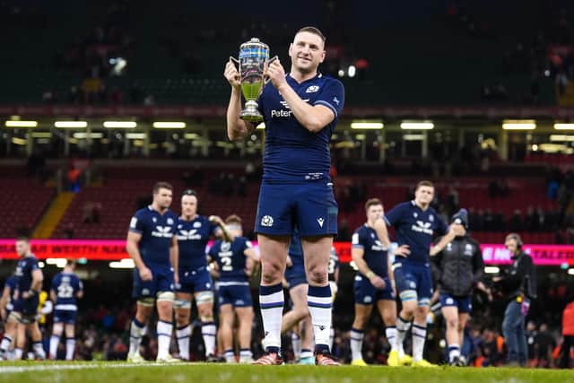 Scotland's Finn Russell celebrates with the Doddie Weir Cup after victory against Wales in the Guinness Six Nations match at the Principality Stadium, Cardiff. Picture date: Saturday February 3, 2024.