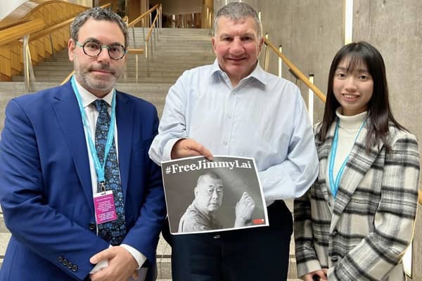 Mark Sabah and Chloe Cheung of the Committee for Freedom in Hong Kong Foundation, with MSP Jeremy Balfour at the Scottish Parliament.