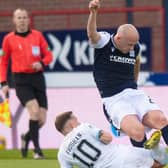 Dundee skipper Charlie Adam (right) battles for the ball with Raith Rovers goalscorer Lewis Vaughan  (Photo by Mark Scates / SNS Group)