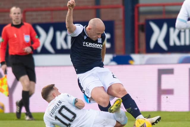 Dundee skipper Charlie Adam (right) battles for the ball with Raith Rovers goalscorer Lewis Vaughan  (Photo by Mark Scates / SNS Group)