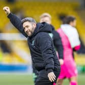 Hibs manager Lee Johnson celebrates the 4-1 victory over Livingston at full time with the visiting fans.