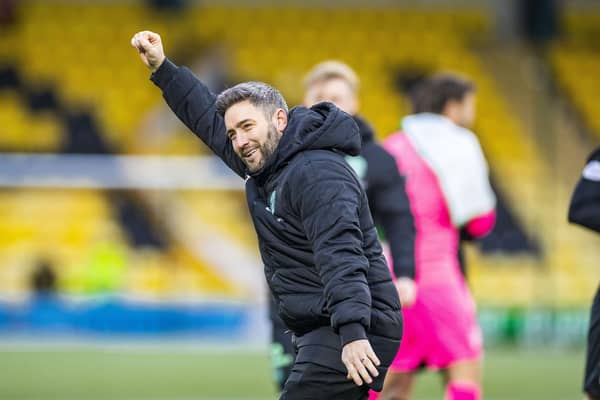 Hibs manager Lee Johnson celebrates the 4-1 victory over Livingston at full time with the visiting fans.
