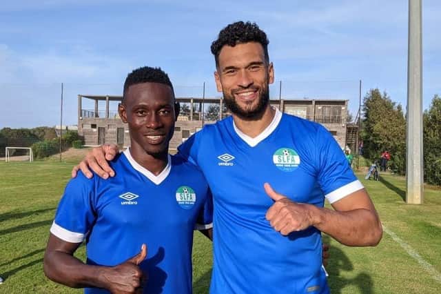 Steven Caulker (right) is all set to start a new international career with Sierra Leone, the country of his grandfather William's birth